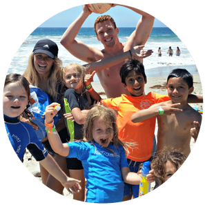 Kids and counselors having fun at the beach at Aloha Beach Camp.