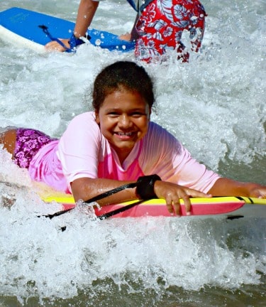 Girl boogie boarding at Aloha Beach Camp