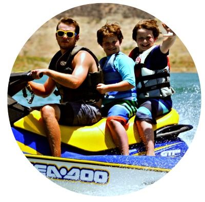 Two boys from Hancock Park jet skiing with their Camp Counselor at Aloha Beach Camp