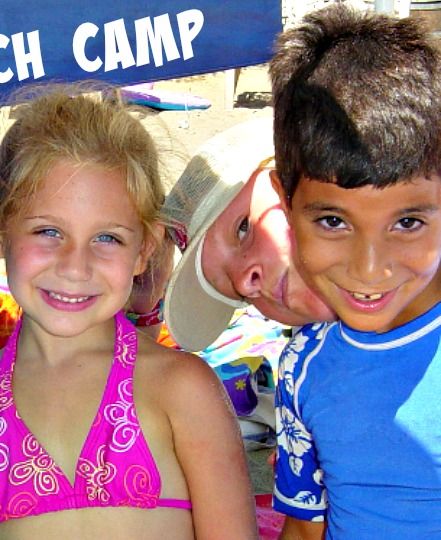 Boy and a girl sitting together on the beach with their camp counselor sneaking her face into the picture behind them at Aloha Beach Camp Summer Day Camp in Los Angeles. CA.